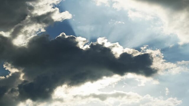 Sunlight Bursting Through Storm Clouds.Cloudscape timelapse