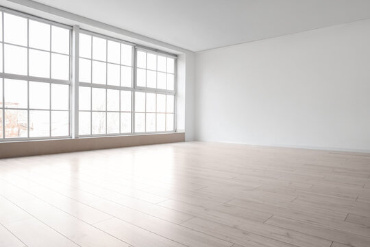View of big empty room with large window