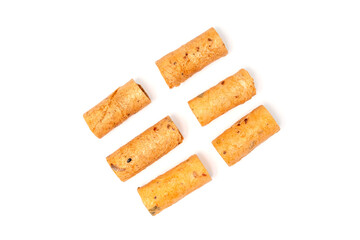 Crispy coconut rolls (Thong Muan) or Rolled Coconut Wafers on isolated white background. Top view