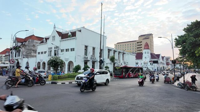 Surabaya, Indonesia - July 2025: Crowded Evening at Surabaya's Historic Crossroads