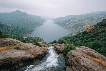 breathtaking view of reservoir edge in iran under overcast sky captured from topdown perspective
