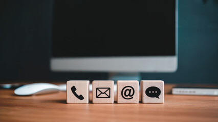 Contact us today wooden block icons by computer for responsive communication