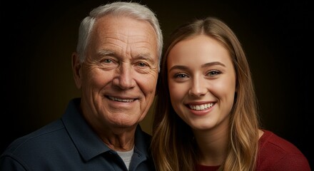 Smiling portrait of an older man with grey hair and a younger woman against a dark background, showcasing intergenerational connection.