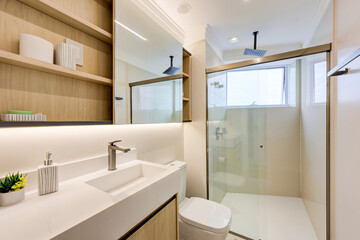 Bright Modern Bathroom with Gold‑Framed Glass Shower & Ocean‑View Balcony