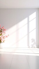 Soft pink flower shadows cast on plain white wall in natural light, clean minimal