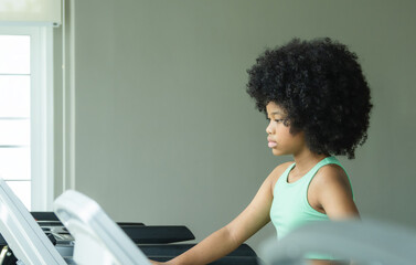 Child girl black smile like training active exercise sport run jogging on treadmill machine test...
