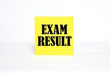 Exam Result on sticky note paper. bright white background.