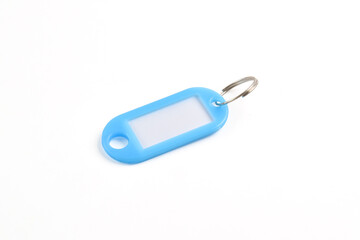 Light blue plastic key tag isolated on white background