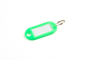 Green plastic key tag isolated on white background