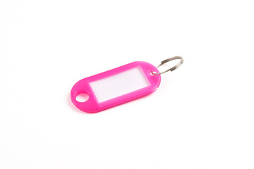 Pink plastic key tag isolated on white background