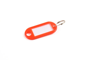 Red plastic key tag isolated on white background