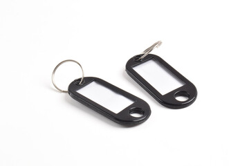 Black plastic key tag isolated on white background