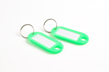 Green plastic key tag isolated on white background