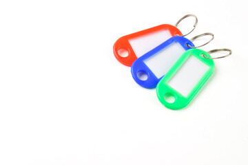 Colorful plastic key tag isolated on white background