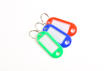 Colorful plastic key tag isolated on white background