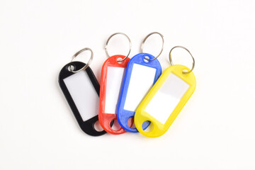 Colorful plastic key tag isolated on white background
