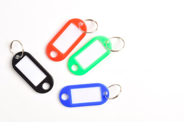 Colorful plastic key tag isolated on white background