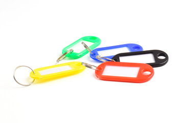 Colorful plastic key tag isolated on white background