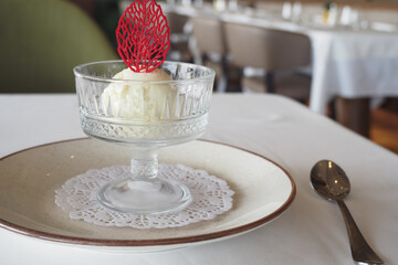 ice cream served in an elegant glass bowl at a restaurant