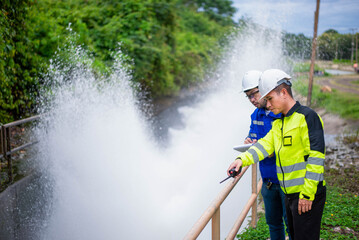 Expert architect and dam engineer are working together to plan for expanding the size of the sluice...