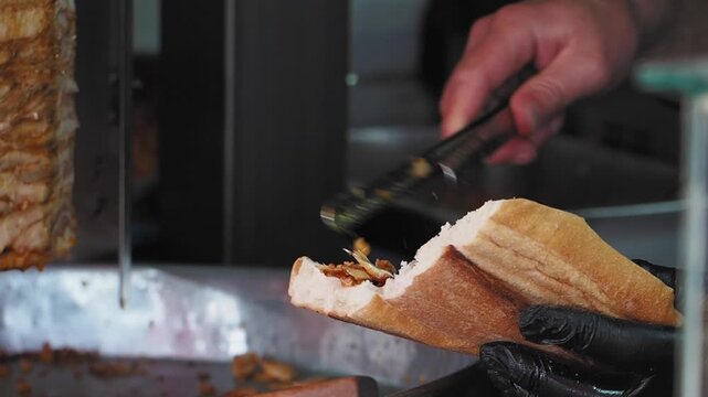 preparing a delicious doner kebab sandwich.