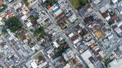Aerial view of busy urban intersections with crosswalks and red pedestrian markings