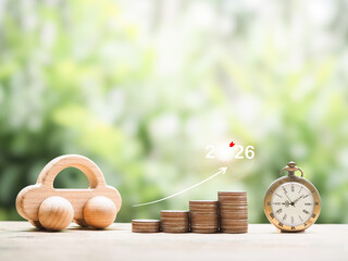 Vintage watch, Wooden toy car, stack of coins with arrow rising up. The concept of saving money and manage time to success transportation, Car loan in year 2026