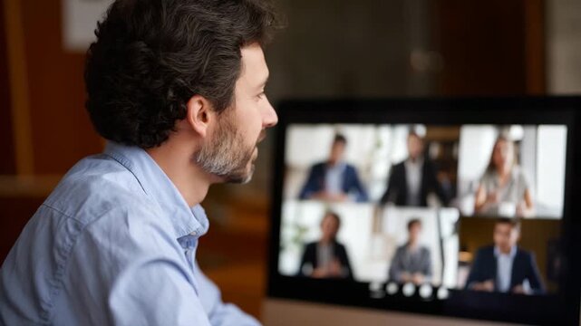 A thoughtful businessman engages in a video conference, showcasing the modern workplace and the shift towards remote collaboration in today's digital landscape.