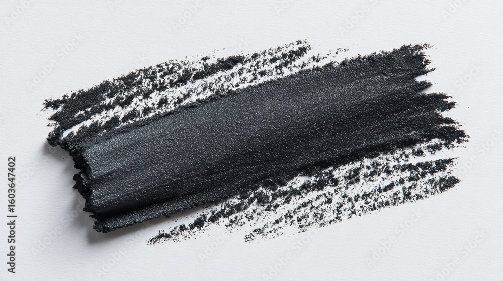 Aufkleber a single dark charcoal stroke on a white background with visible texture and rough edges detail