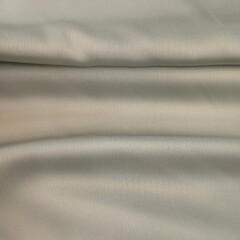 Obraz premium Folded Grey Fabric Texture Close-up with Soft Lighting