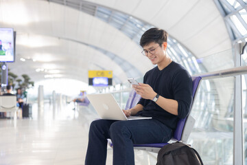 close up young asian businessman use smartphone to check about email or notification from social...
