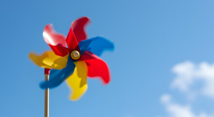 Colorful pinwheel against a clear blue sky (1)