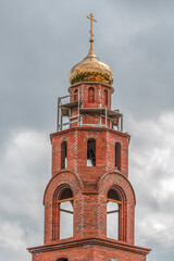 An unfinished Orthodox church on a summer day