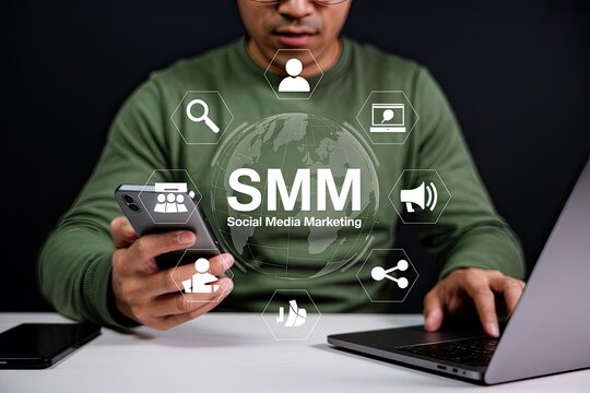 Man using smartphone and laptop with social media marketing smm icons and globe overlay for digital strategy