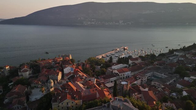 Aerial flight past old fortress toward Herceg Novi marina, Montenegro