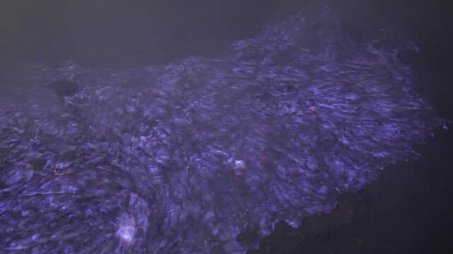 Close up shot of the famous blue flame phenomenon at Kawah Ijen volcano crater.