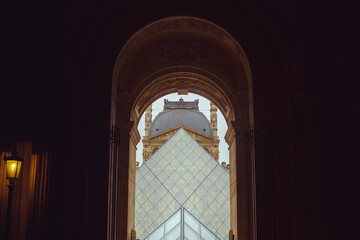 Louvre Pyramid and Dome Viewed Through Archway in Paris, France at Twilight