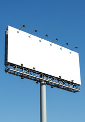Angled blank white billboard against blue sky for advertising