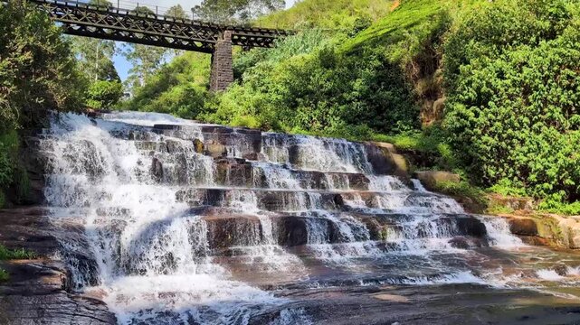 Scenic view of Nanu Oya waterfall with cascading free flowing water in highlands of Sri Lanka