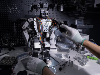 Repair the robot on the workbench