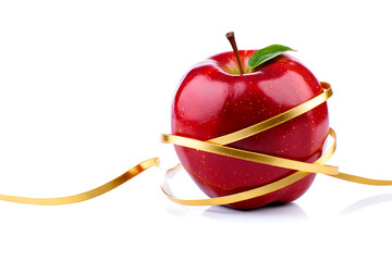 Bright red apple wrapped with a golden measuring tape symbolizing healthy eating and weight loss