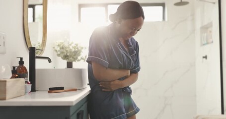 Black woman, stomach ache and bathroom with pain for gastro reflux or indigestion in home. Female person, cramp or sore tummy with diarrhea or constipation, bowel or bladder infection in house - Powered by Adobe