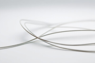 delicate winding thin lines gracefully dance across immaculate white background creating elegant visual experience