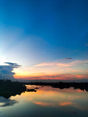 Obraz premium sunset over the river