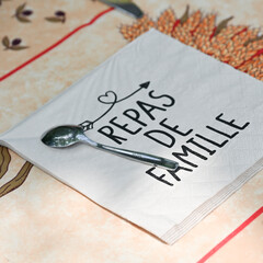 Paper towel with writing family meal on a table in summer. High quality photo