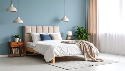 A bedroom interior with a light blue wall