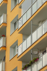 A tall building that features numerous balconies on its exterior, enhancing the overall...