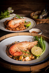 Pad Thai with thin noodles, dry, and tamarind sauce mixed with eggs and minced tofu. Thai food.