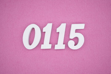 The numbers are made of white painted wood, placed on a pink paper background.