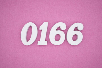 The numbers are made of white painted wood, placed on a pink paper background.